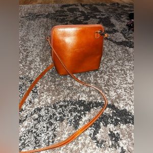 Burnt Orange Vera Pelle crossbody purse.